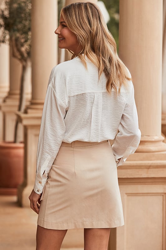 Neutrals are so now
Trending safari pocket detail
Contrast buckle and buttons for a luxe look
Thigh-grazing mini hem
Add polish with a linen shirt and heels
Dress it down with a tee, shacket and trainers