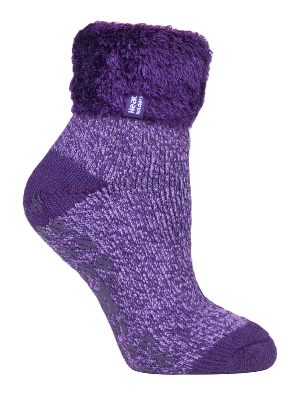 Lounge around the home in these cosy socks. Whether you're looking to stay warm or comfortable indoors, these lounge socks feature a cute and stylish design so you can pair them with any casual outfit! Every Heat Holders® sock, including these lounge socks, are created by UK PATENTED knitting technology. This unique manufacturing process together with Heat Holders® innovative Japanese designed thermal yarn ensures maximum warmth is held close to the skin, keeping your feet warmer for longer. With a strong TOG rating of 2.34, these socks are designed to keep your feet warm as well as retain heat close to the skin. They also prevent your feet from feeling clammy with their soft brushed inner thermal lining. With long pile cushioning, these thermal socks will help keep feet fully comfortable and supported. Heat Holders are made from a specially developed heavy bulk yarn which has extreme thermal-like qualities. These socks would make the perfect gift for any woman who suffers cold feet! Choose from our different colours and styles to suit your woman's fashionable needs! Why not treat yourself to these lovely pair of cosy socks to wear in bed? Featuring a turn over cuff, you can pull up or roll down these socks for a much more comfortable fit! These socks also have a low cut ankle length so you can subtly show off your socks! Stop sliding or slipping on wooden or tiled floors with these non-slip gripped socks. They feature a rubber-like non-slip grip so you can walk around the home comfortably. These socks are available in womens sizes 4-8 UK