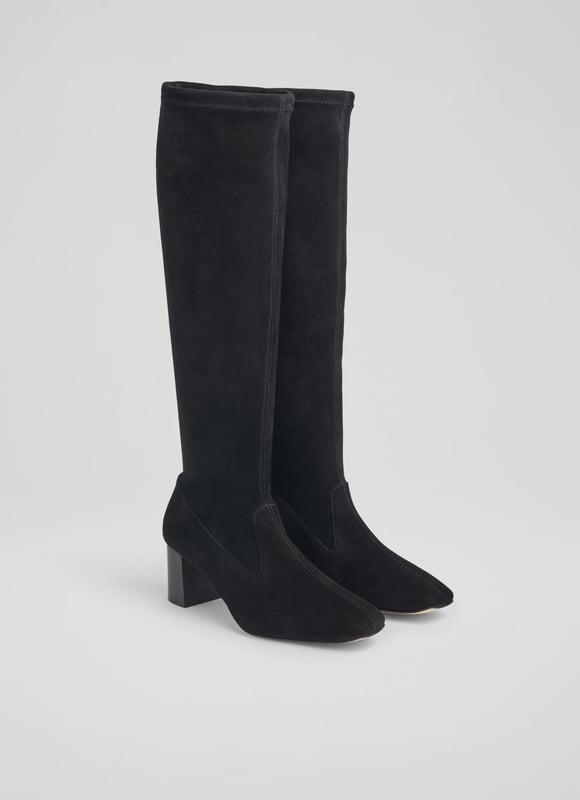 LK Bennett Davina Knee Boots, Black An elevated essential for any winter boot collection, our new Davina knee-boots offer a sleek look and a perfect fit. Crafted in Spain from beautiful black stretch suede, they have a square toe, a slim fit and a 60mm stacked block heel. Pull them on under winter skirts and dresses when it's time to up the winter layers.