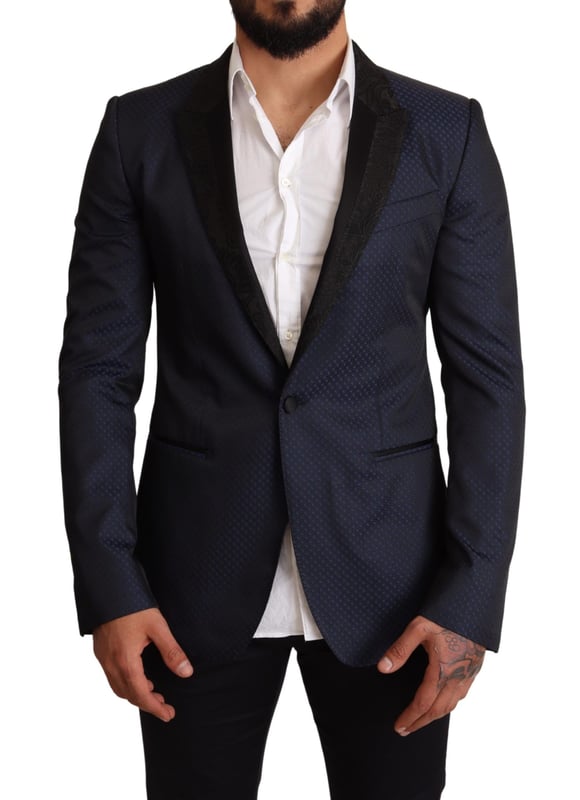 Stunning Dolce & Gabbana MARTINI Slim Fit Blazer Jacket
  Single breasted one-button style
  Slim fit for a great fitting and comfort
  Beautiful blue color
  Three outside pockets and two inside pockets
  One open vent in the back for breathability
  Logo details for a signature touch
  Made in Italy with premium materials
  Material: 6% AC 50% PL 11% Silk 33% Wool
  Lining: 100% Silk
Material: 6% AC 50% PL 11% Silk 33% Wool
