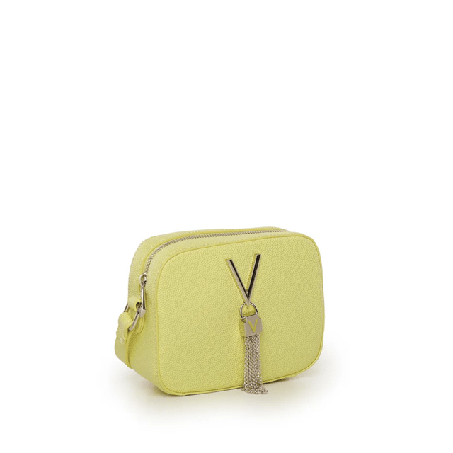 Discover essential elegance with Valentino's latest addition: a shoulder bag perfect for adding style to every moment of yours, from a stroll to brunch with friends. A chic design with softly rounded corners and a practical top zipper ensures a secure closure, keeping contents always within reach. Think of the convenience of an adjustable strap that fits you, long or completely detachable to transform it into an elegant clutch. A tassel that sways with your step adds that extra touch. And for your little treasures? The internal lining will safeguard every precious item. With this Valentino bag, you're ready to face the day with style and elegance! Size 13 x 17 x 3 cm
