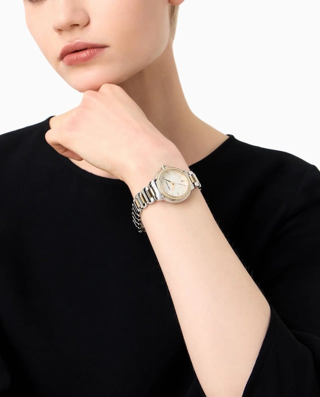 This Emporio Armani Mia Analogue Watch for Women is the perfect timepiece to wear or to gift. It's Multicolour 32 mm Round case combined with the comfortable Multicolour Stainless steel watch band will ensure you enjoy this stunning timepiece without any compromise. Operated by a high quality Quartz movement and water resistant to 5 bars, your watch will keep ticking. This elegant, fashionable watch set with beautiful stones is a perfect gift for New Year, birthday,valentine's day and so on High quality 19 cm length and 15 mm width Multicolour Stainless steel strap with a Deployment clasp Case diameter: 32 mm,case thickness: 9 mm, case colour: Multicolour and dial colour: Mother of pearl