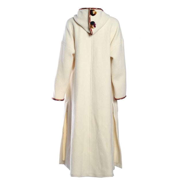 Button Up. Long Sleeved. 100% New Wool / 53% Viscose, 47% Cupro. Embroidery Thread: 100% Viscose. Braid1: 100% Cotton. Pompoms: 50% Silk, 50% Viscose.