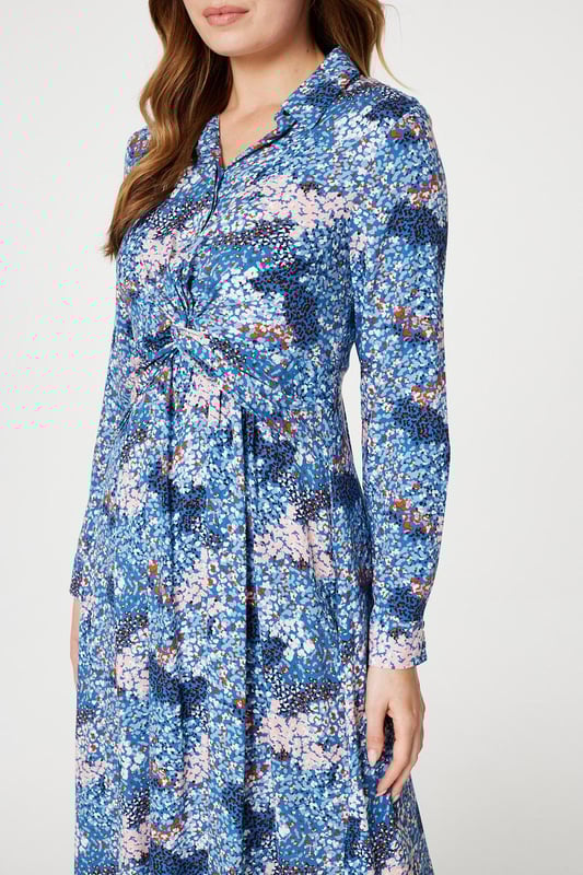 Refresh your daytime occasion wear collection with this printed midi dress. It has a classic collar with a v-neck, button front detail, a twist front embellishment, long sleeves with cuffs, a shirred back detail and a midi length skirt with a side split. Finish your look with elegant blush heels and an a neutral clutch bag.