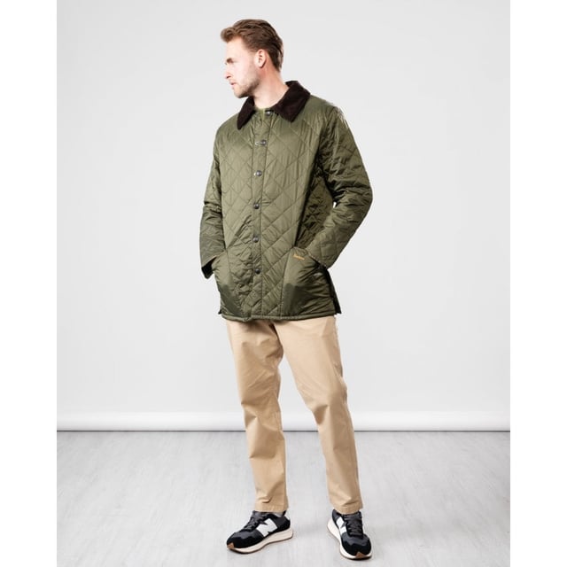 The Liddesdale provides plenty of room for laying and a generous fit, we suggest you go down one size if you prefer to wear this as a summer jacket. One of the most iconic Barbour jackets, the original Liddesdale jacket is a firm favourite year after year.
With Barbour's signature diamond quilted outer and a warm yet lightweight contrast nylon lining, this popular men's quilted jacket is durable, simple and stylish. From the Classic collection and available in a range of wearable colours, it features a robust front stud fastening to protect from the elements, and a smart sit-down cord collar that can be raised for additional warmth and protection, with a luxuriously soft feel against the skin.
With a generous fit, the Liddesdale provides plenty of room for layering up with chunky knits and insulating gilets, while the studded rear vents ensure comfort and ease of movement. The signature front patch pockets are trimmed with contrast Barbour embroidery and are generously proportioned, while a zipped inner security pocket safeguards valuables. A timeless addition to any winter wardrobe.

Regular Fit
100% polyamide
Two inch box quilted with 100g polyester wadding
Machine washable
Back length: 30-34in / 76.3-86.3cm