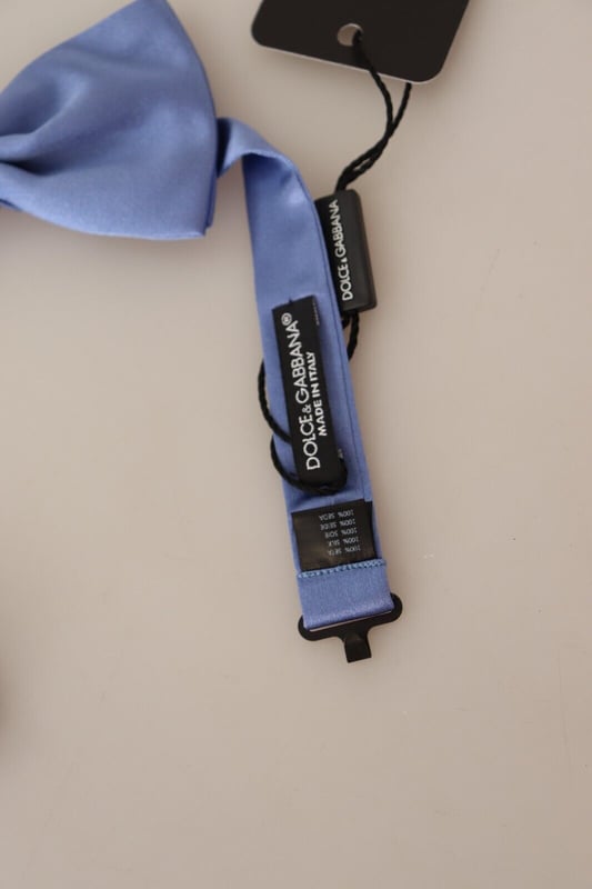 Brand: Dolce & Gabbana
  Condition: Brand New with Tags
  Color: Purple
  Style: Tied
  Material: 100% Silk
  Features a metal clasp in the form of a hook
  Adjustable length neck strap
  One size fits all
  Made in Italy
Material: 100% Silk