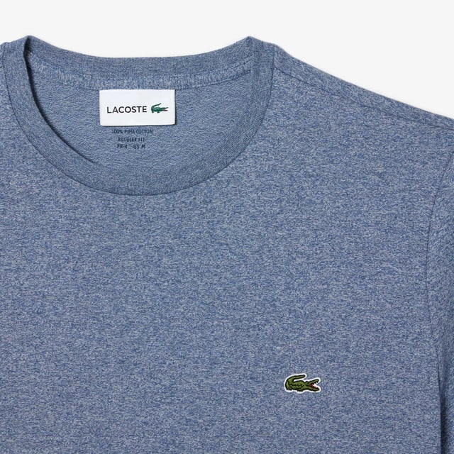 Mens Lacoste Crew Neck Pima Cotton Jersey T-Shirt in blue.- Ribbed crew neck.- Short sleeves.- Embroidered Lacoste logo at left chest.- Tonal back neck tape.- Super soft pima cotton jersey fabric.- Regular fit.- 100% Cotton.  - Ref: TH6709-1GF