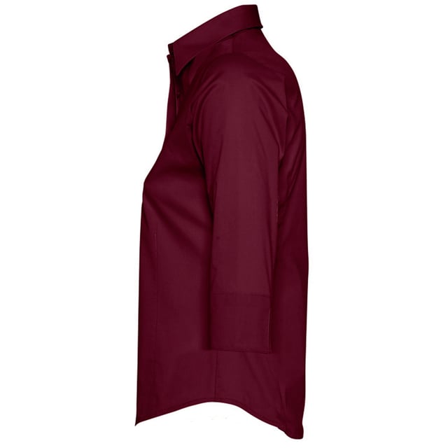 Stretch fabric. Stiffened collar. Self colour buttons. Slitted cuffs. Front and back darts. Curved hem. Fabric weight: 140 gsm. Material: 97% cotton/3% elastane. Ladies size: XS(6/8), S(8/10), M(10/12), L(12/14), XL(14/16), XXL(16/18).