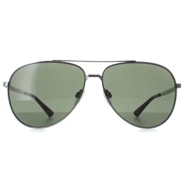 Calvin Klein Aviator Mens Light Ruthenium Green CK22124S  Sunglasses are a harmonious blend of contemporary design and timeless sophistication. Crafted with precision and elegance, these sunglasses feature a sleek and minimalist frame that embodies understated luxury. They boast a lightweight construction for all-day comfort, while its lenses offer superior sun protection and reduce glare, ensuring optimal clarity and vision.