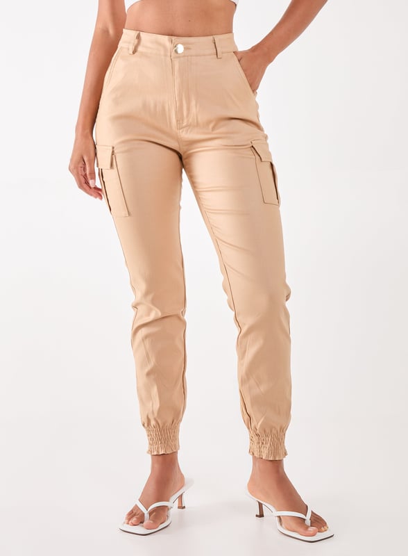 Featuring a PU material and buckle detailing. Team our Cuffed Cargo Trousers with your existing wardrobe pieces for a blogger-worthy look.