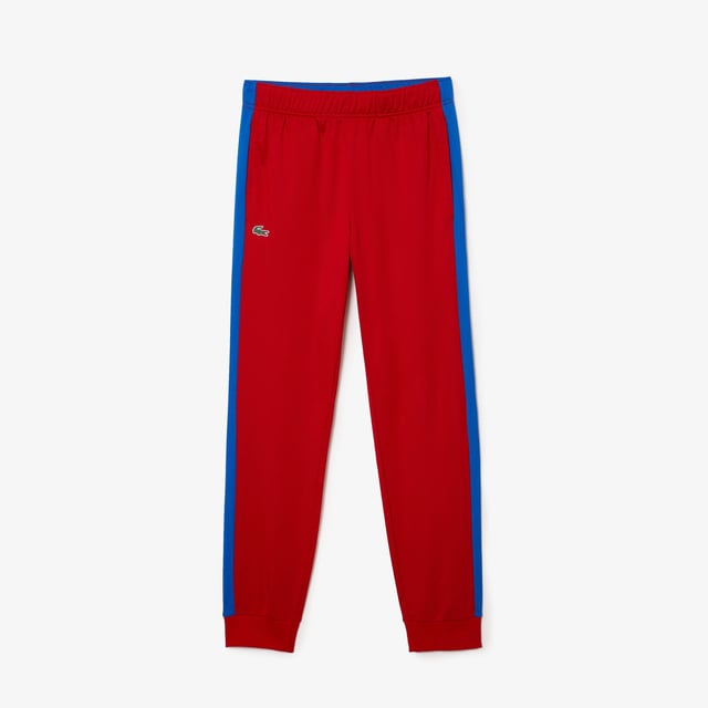 Men's Lacoste SPORT Run-Resistant Tennis Trackpants.- Regular fit, natural ease: The perfect fit for workouts.- Drawstring waist: Customised comfort and fit.- Contrast print on side: The iconic Lacoste colour-block.- Rigid crocodile sewn onto front: Quintessentially Lacoste.- Recycled polyester run-resistant piqué: Lightweight. Environmentally friendly. Material: 100% Polyester. Ref: XH9427W50.