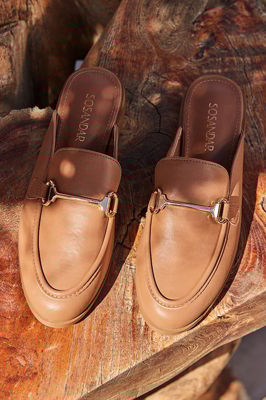 Dress from the feet up
Easy slip-on backless style
Wear-with-everything neutral
Timeless snaffle trim detail
They'll take you from work to weekend
We love them with white denim or linen trousers