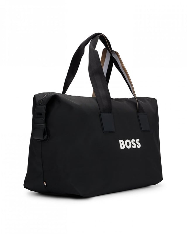 A cleanly styled holdall by BOSS crafted in textured material with contrast branding and signature-stripe detailing on the handles and removable strap. For our BETTER BOSS products, we always use at least 60% better raw materials. This product is made from at least 60% recycled polyester. Recycled polyester is an artificial fibre made from oil-based waste such as old PET bottles. Measurements: 26 x 48 x 26cm
Length: 48,0 cmWidth: 26,0 cmHeight: 26,0 cmFastening top: Two-way zip closureDouble handlePackaging: Dust bag
100% Polyester (recycled), Lining: 100% Polyester (recycled), Facing: 100% Polyamide (recycled), 60% Polyurethane, 40% Polyester
 
50511942
 
 