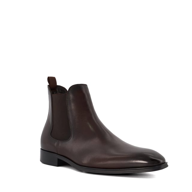 Dune Mens MANDATORY Chelsea Boots Mandatory Synonymous with Dune London, the Chelsea boot is a long-standing classic favoured for its transitional appeal. Signature style Mandatory perfectly blends a contemporary aesthetic with our iconic heritage. Crafted from the finest material and detailed with a quintessential elastic side gusset and grosgrain pull tab, this almond-toed silhouette has been set on a durable rubber outsole. Finished with tonal stitching, this timeless style will become a go-to dressing solution throughout the season.
