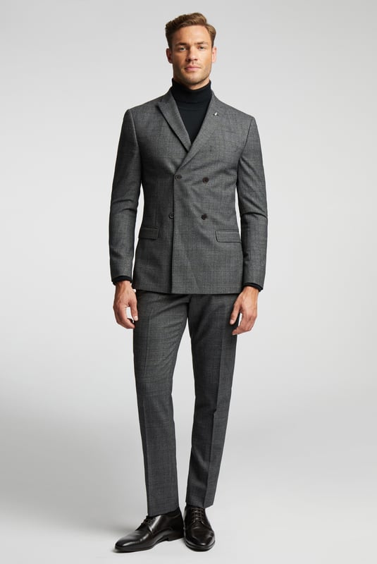 Slim Fit Pow Check Jacket Our Sagan suit jacket is here to make your formalwear look as sharp as ever. Crafted in luxurious wool blend with a charcoal blue pow check design, this double breasted slim fit jacket will make for a smart addition to your wardrobe. Complete with signature Ted Baker floral lining and a delicate leaf lapel pin, for guaranteed comfort and elegance.