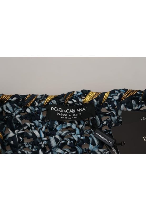 Cardigan Azul Botón Hecho A Mano Suéter  
marca DOLCE & GABBANA  
Hecho en Italia  
Color azul con logo dorado  
Diseño elegante y lujoso  
Prenda versátil para looks casuales o más arreglados  
Cómodo y de calidad  
Perfecto para combinar con jeans o pantalones  
Agrega elegancia a cualquier conjunto  
Material: 5% Elastano 10% PA 65% PL 10% VI 10% Cuero