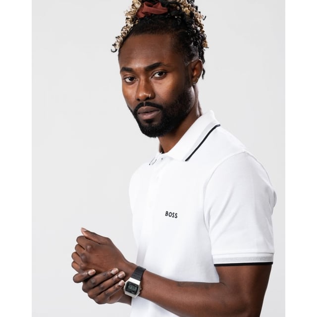 A signature polo shirt by BOSS Menswear, cut to a regular fit. Featuring contrast tipping and a logo at the left chest, this short-sleeved polo shirt is designed in cotton piqué and detailed with further BOSS branding at the undercollar.
Regular fit. Flat-knit collar. Number of buttons: 3. Short sleeves. Flat-knit cuffs. Standard length. 100% Cotton.
50469055
Model is 5"8 and wears size M