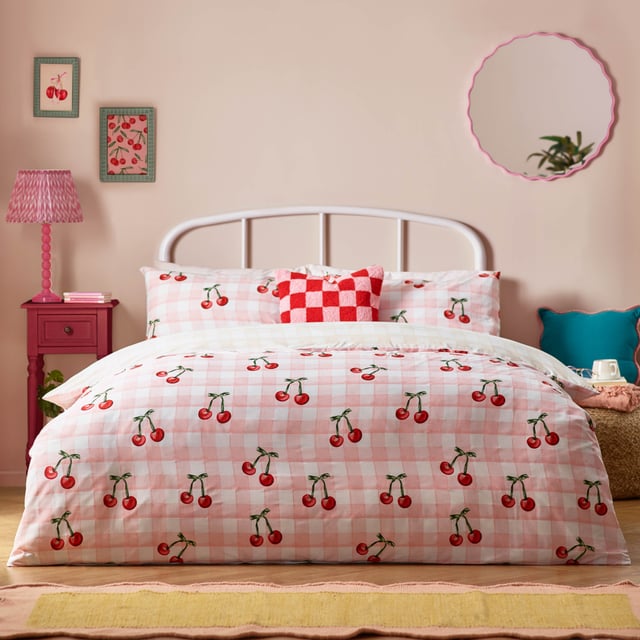 Introducing the Cherry Gingham Duvet Cover Set—a delightful blend of classic charm and modern flair perfect for those who cherish individuality. Crafted from high-quality 68 Pick Polycotton, this reversible duvet cover promises comfort and style in equal measure. The timeless gingham pattern is playfully adorned with bold red cherries, adding a touch of whimsy to your bedroom decor. Whether you're a positive thinker or someone who values unique self-expression, this bedding invites you to create a personal sanctuary that reflects your vibrant personality. Experience the joy of modern design with a touch of tradition, ensuring restful nights and chic aesthetics.