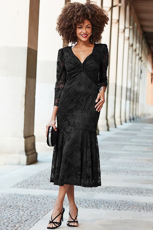 All of the impact, none of the effort Cut from luxurious lace with the perfect amount of stretch That twist neckline is so flattering Nipped-in waist falls to a dreamy tiered hem Framed by stunning sheer puff sleevesAdd some sparkle with jewelled accessories
