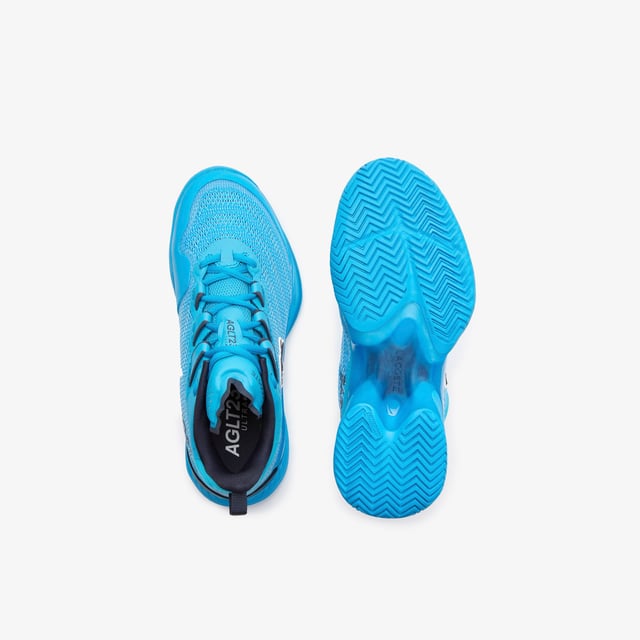 A new model this season  the AG-LT23 Ultra is designed to push tennis players’ abilities further than ever before with their lightweight and responsive design. From the Pebax technology that provides energy return  via the LSRFoam forefoot midsole  in combination with the enhanced stability offered from the TPU Plate Chassis and Heel Stabiliser  to the engineered breathable leno ‘Pique’ weave mesh upper for enhanced fit & breathability  they’re the innovative shoe every player needs to up their game. The outsole features Lacoste's brand new rubber compound; LineGrip. - Pro level performance Tennis shoe offering enhanced stability - Engineered breathable leno ‘Pique’ weave mesh upper for enhanced fit & breathability - Internal midfoot lockdown cage - Lacoste Super Responsive (LSR) Foam midsole in the Forefoot - High Performance EVA Foam in the Heel for enhances shock absorption - Full-length TPU plate chassis and heel stabilizer - 'LineGrip' Rubber Outsole - Ref: 745SFA001111C