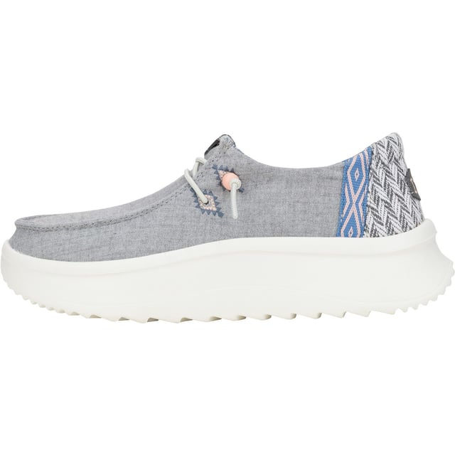 Up your style game with Wendy Peak Chambray Woven. Added, cushy comfort and height meets woven textile heel and webbing details for the perfect mix of comfort and style. So easy to put on you'll never wanna take 'em off.