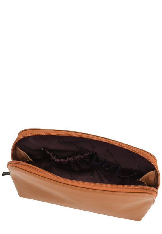 This staple zip around cosmetic bag in genuine leather, inside features a zip pocket, elasticated pocket and elasticated cosmetic holders. This minimal design includes a debossed logo and gunmetal zip pull. Features: , Zip around fastening, Smith & Canova debossed logo, Smith & Canova branded interior, Inner zip pocket, Elasticated pocket, Genuine Leather Style Ref: 26833 TAN