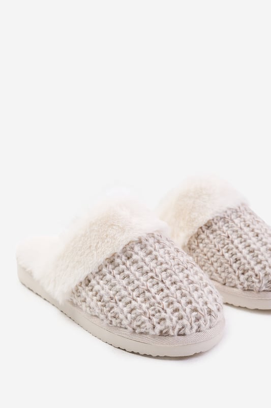 Experience ultimate comfort and cozy warmth with our Lounge Slip On Knitted Slippers With Fur Trim. These luxurious slippers are perfect for lounging at home or keeping your feet snug during colder seasons.Key Features:



Soft Knitted Upper: The knitted upper design adds a touch of style and texture to these slippers, while also providing a comfortable and cozy feel.

Faux Fur Lining: The Faux fur lining envelops your feet in warmth and softness, making these slippers a cozy sanctuary for tired feet. Say goodbye to cold toes and hello to ultimate comfort.

Easy Slip-On Design: These slippers feature a slip-on design, allowing you to effortlessly slide your feet in and out of them. Perfect for those relaxed and casual moments when you need to quickly put on cozy footwear.

Durable Sole: The durable sole provides traction and support, making these slippers suitable for both indoor and outdoor use. Enjoy the versatility of being able to step outside without changing your footwear.

Specifications:Material:


Upper: Synthetic
Lining: Faux fur for warmth and coziness
Sole: Durable sole for indoor and outdoor wear


Closure: Slip-on design for easy and convenient wearing

Pamper your feet with our Lounge Slip On Knitted Slippers With Fur Trim. Indulge in the utmost comfort and enjoy the luxurious feel of these slippers while effortlessly adding warmth and style to your everyday relaxation routine. Say hello to cozy evenings and happy feet with our irresistible slippers.