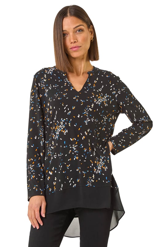 Abstract Print V-Neck Tunic Top from Roman. Inject some fun into your wardrobe with this abstract print tunic top, perfect for the Autumn Winter season. The flattering v-neckline and long sleeves will keep you warm and stylish. Crafted from stretchy jersey fabric, this top features a vibrant abstract print with a contrasting hem, all designed in a trendy tunic shape. Simply pair with jeggings and ankle boots for a fashionable fall look.