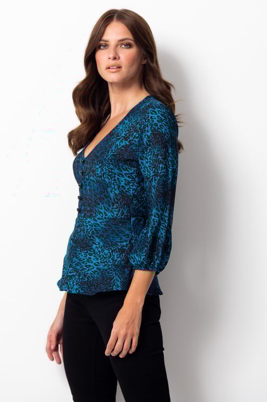 REASONS TO BUY


Because you always have room in your wardrobe for animal print
Peplum waist creates the perfect silhouette
Plunging V-neck, perfect for all bust sizes
Button detail for a luxe look
Effortlessly chic
Pair with black jeans or cropped trousers to nail the ‘jeans and a nice top’ dress code