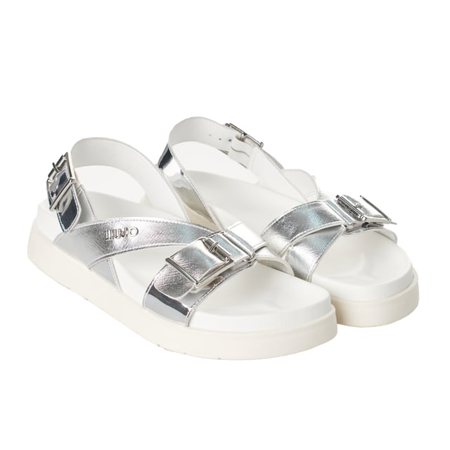 Sandalias con plataforma de Liu Jo con un diseño elegante que combina detalles brillantes y funcionalidad para un estilo moderno.

Características:

- Sandalias de plataforma elevada que proporciona comodidad y altura, ideal para un look contemporáneo.
- Tiras cruzadas con acabado metálico que añaden un toque sofisticado y distintivo.
- Cierre ajustable en el tobillo con hebilla metálica para un ajuste seguro y personalizado.
- Detalle del logotipo Liu Jo grabado en una de las tiras, reflejando autenticidad y exclusividad.
- Plantilla acolchada para garantizar confort durante todo el día.
- Alto de la plataforma: 4 cm. 
- Incluyen bolsas de almacenamiento para mayor cuidado y protección.

Estas sandalias de plataforma Liu Jo destacan por su diseño moderno y cómodo, perfectas para realzar cualquier outfit con elegancia y practicidad.
 Composición: Exterior: Poliuretano; Interior: Piel; Plantilla: Poliuretano; Suela: TPR
 Cuidados:
- Limpiar con un paño húmedo.
- Evitar mojarlas en exceso.
- Guardar en un lugar fresco y seco.