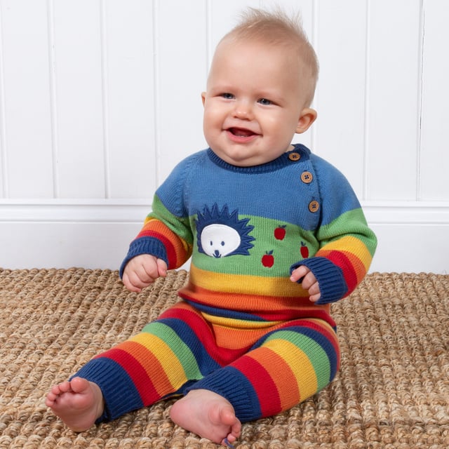 Bright and beautiful! Perfect for playing or snoozing, our hedgehog knitted romper is comfy, practical and great for the season. Featuring a rainbow stripe and cute knitted hedgehog design.