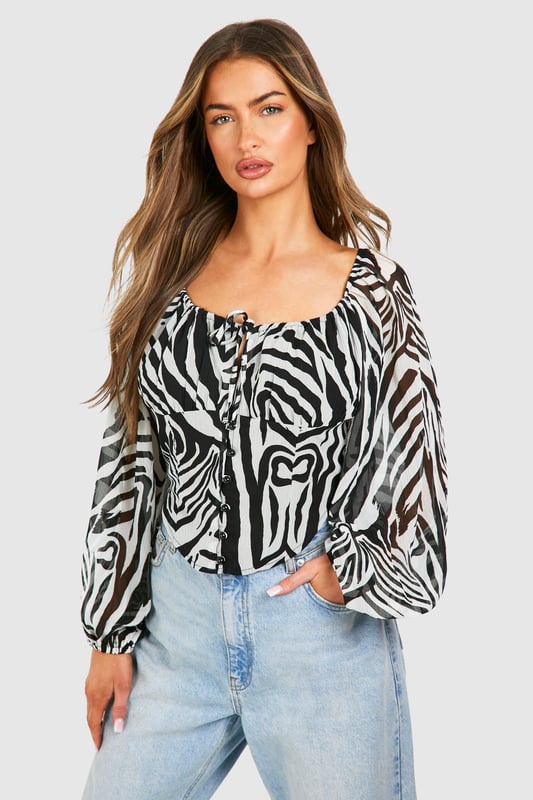 Calling all trend-obsessed: category is... regency vibes. This waist-defining corset top shapes and contours the body, accentuating the bust and creating a snatched silhouette. With strappy tops that'll look fire with that perfect pair of jeans, blouses that'll turn heads in the office, and bustiers that are just waiting to be matched with some hot leather look trousers, it will be love at first scroll when you lay eyes upon our collection of corset tops.Style: Crop TopDesign: ZebraFabric: PolyesterLength: CroppedNeckline: CrewSleeve Length: Long SleeveModel's height: 170cm / 5'7"