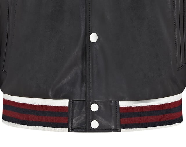 Introducing the Men's Baseball Leather Jacket, a perfect blend of classic varsity style and modern craftsmanship. This letterman bomber jacket features contrasting sleeves and a striped knit ribbed collar, waistband, and cuffs for a timeless athletic look. The press studs front closure and embroidered brand logo patches on the chest and sleeves add a touch of authenticity and flair. Designed with practicality in mind, it includes two jet pockets at the waist and two inside welt pockets for your essentials. The panelling to the back of the jacket ensures a tailored fit and superior comfort.

Contrasting sleeves for a stylish look
Striped knit ribbed collar, waistband, and cuffs for a classic finish
Press studs front closure for easy wear
Embroidered brand logo patches on the chest and sleeves for added detail
Two jet pockets at the waist and two inside welt pockets for convenience