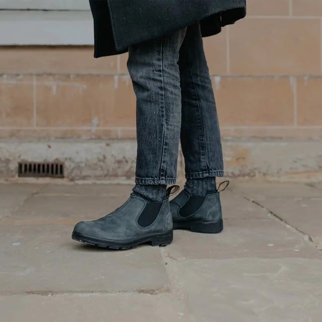 Building on the infallible Blundstone original series, the Blundstone 2035 offers the same great styling, comfort and practicality you can expect from the Blundstone original series in a new, iconic low cut design. Crafted with premium leather uppers in the Rustic black colour, the Blundstone 2035s maintain outstanding water resistance in a new and fresh design. With the special comfort cuff, these Blundstone are just as comfortable as its bigger brothers, and the ergonomically engineered toe spring combined with XRD® Technology in the heel further reduces wearer fatigue while increasing comfort. Additional leather heel protection and the durable TPU outsole ensure that this low-cut boot will last you many seasons to come. A versatile and stylish shoe, the Blundstone 2035 is a versatile shoe for those that want to look stylish on the go.  2.5mm thick premium black leather uppers Black elasticated sides and iconic pull tags for easy slip-on Padded collar for outstanding comfort Highly durable TPU outsole Cushioned midsole for all-day comfort Blundstone SPS Max Comfort system for superb shock absorption Removable footbed Lightweight for all-day everyday comfort