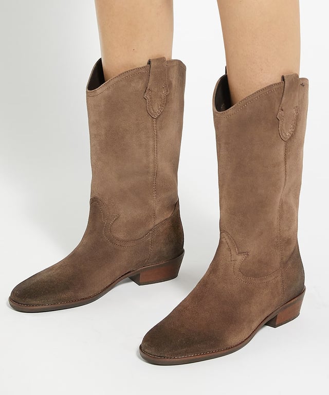 Dune Ladies Prickles - Low Block Heel Cowboy Boots Infuse your look with Western charm and opt for Prickles, a must-have pair of cowboy boots that are always on trend. Perfect for picnics, festivals and beyond, these boots feature a comfortable low block heel and detailed stitching, making them versatile enough for both daytime outings and evening events.