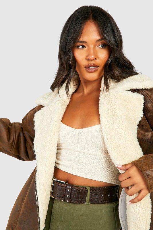 Take your outfit to new style heights with an aviator jacket. Perfect for layering, create a stylish oversized silhouette as you choose from crop belted jackets to faux fur lined options. A cross between a classic flight jacket and a leather biker, it's all about the detailing with this snug winter staple. Pair your aviator coat with high waisted mom jeans and a fierce attitude as you stroll your way through your social calendar.Style: Aviator JacketFabric: WovenLength: RegularNeckline: CollaredSleeve Length: Long Sleeve