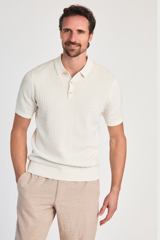 This textured polo shirt from Nines Collection blends classic sophistication with modern design. Crafted from a premium cable fabric with a subtle pattern, it offers a refined yet contemporary look. Lightweight and breathable, it’s a versatile choice for smart-casual occasions, ensuring style and comfort effortlessly. Made from 100% Cotton.