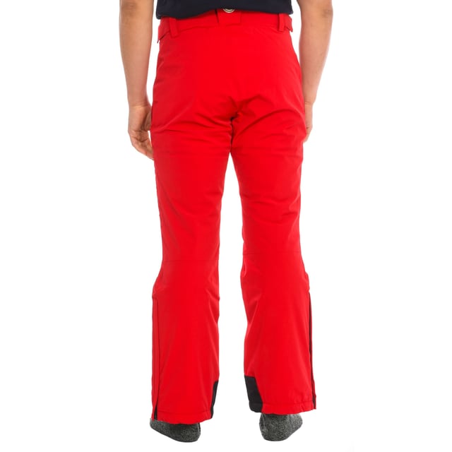 Ski pants Vuarnet.
 2-layer stretch fabric with high-performance membrane.
 Waterproof: 20000mm
 Breathability: 10000mvp
 Warmth level: Medium
 Adjustable belt with velcro and hidden elastic.
 Front opening with zipper and snap button.
 Two zippered hand pockets
 Adjustable lower leg with zipper.
 Fixed inner gaiter with non-slip bands and reinforced material on the leg.
 Embroidered brand logo on the front and logo on the back.
 Regular fit.
 Seams seen in tone.
 Composition: 87% Polyamide, 13% Elastane
 Care:
Handwash.
 Do not use dryer.
 Do not iron.
 Do not use bleach.
 Do not dry clean.