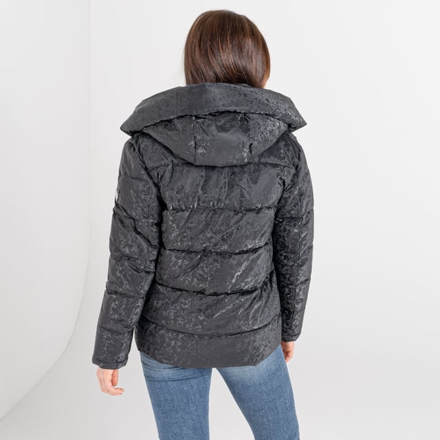 Waterproof and breathable twill fabric - Ared 8000. Water repellent finish. High warmth padding. Tapeds seams. Ski features including ski pass pocket and detachable snowskirt with gel grip. Detachable hood with adjuster and removable faux fur trim. Velvet touch inner collar. Metal luxe badge and zip pullers embellished with Swarovski embellishment. 2 way metal effect centre front zip with inner zip guard. High volume grown on hood with fold back snap fastenings. 2x lower pockets with metal effect zips. Tonal shine printed lining.