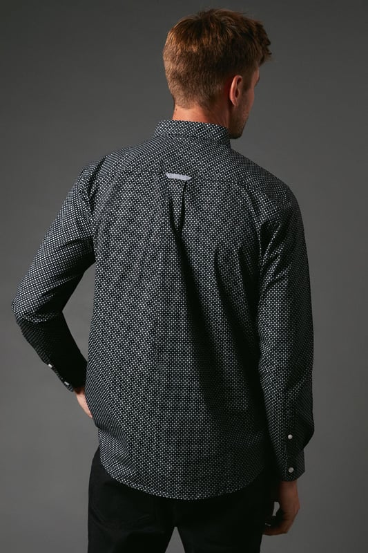Intricate micro floral print for a subtle yet stylish look
        Long sleeves with buttoned cuffs for versatile wear
        Button-down collar adds a touch of refinement
        Single chest pocket for a classic shirt design
        Curved hem allows for both tucked and untucked styling
    
    This Maine micro floral print long sleeve shirt offers a perfect blend of casual charm and refined style. The delicate pattern adds visual interest without overwhelming, making it a versatile choice for various occasions. Pair it with dark trousers and trainers for a smart-casual look that's ideal for family gatherings or weekend outings. For a more relaxed vibe, leave it untucked over your favourite jeans. The button-down collar and long sleeves allow for easy transition from day to evening wear. Whether you're heading to a casual dinner or a laid-back office environment, this shirt adapts effortlessly. Its timeless design ensures it will remain a staple in your wardrobe, ready to be styled for seasons to come.