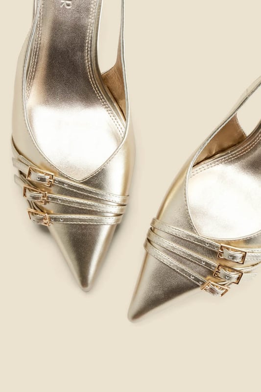 Luxe up your lookTimeless slingback style with a sleek pointed toeSet on a comfy-chic kitten heel Elevated with a statement buckle strap detail Adjustable strap for the perfect fit Dress them down with denim, up with