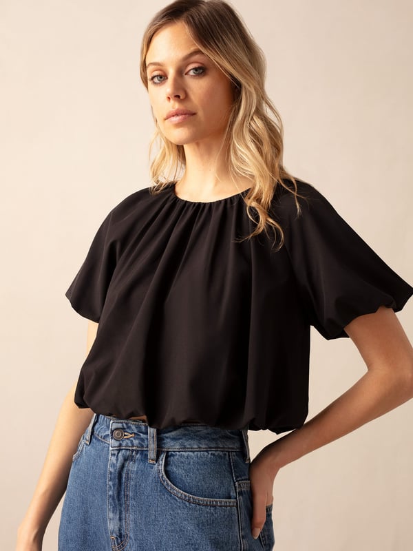 Co-founders' Notes

Introducing the Parachute Top, a relaxed fit with a subtle bubble hem and soft volume short sleeves. This lined style features a discreet zip at the back neck for added convenience. Crafted from lightweight fabric that feels effortlessly comfortable, this shorter length top pairs seamlessly to the waistband of our matching skirt for a laid-back and coordinated look.

Lined

Zip at back neck
Short length top
Relaxed fit. Try your usual size



Fabric &amp; Care



Composition: Main: 92% Polyester 8% Elastane Lining: 100% Viscose


Garment Care: Machine washable



Size &amp; Fit


Relaxed fit. Try your usual size

Length: 46cm (size 10)

Model is 170 cm/5'7" and is wearing a size 10