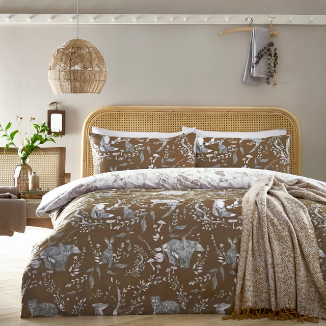 Explore our cosy and delicate take on the beauty of woodland creatures as you rest in the Buckthorn duvet cover set. Hand-drawn rabbits, foxes and bears pose among the delicate florals, which are set on an earth toned background. Flip the set over and the same design appears, but this time in inverted colours, giving you a fresh, evergreen look. An adorable and down to earth addition to your bedroom.