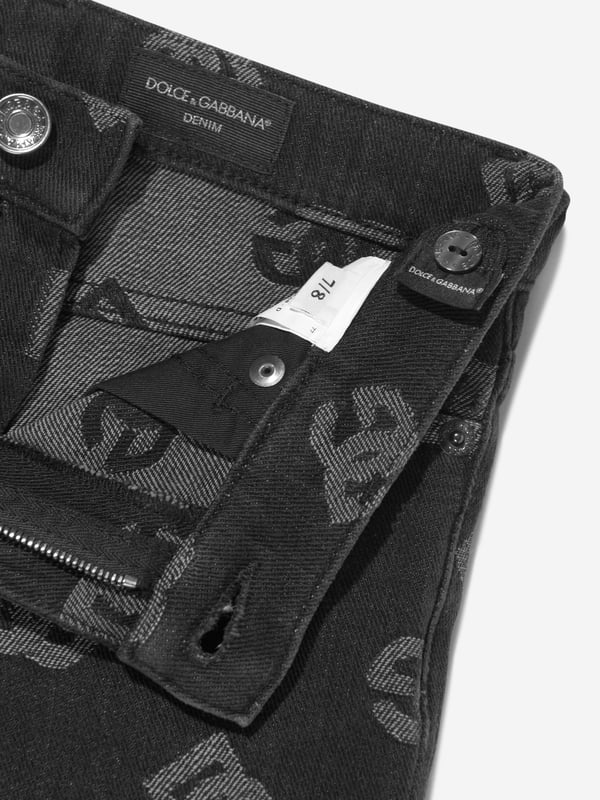 Dolce  Gabbana incorporate innovative materials with vintage abstracts into coexisting spaces. These girls jeans capture the Italian label's mesmeric craftsmanship and purity of design. Crafted in immaculate stretch cotton via a monogram jacquard perspective, silver-tone logo plaque and traditional five pockets. Rivet Detailing Mid-Rise Belt Loops Skinny Cut Concealed Fly and Button Fastening Cotton 98%, Spandex/Elastane 2%