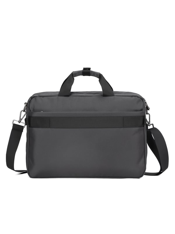 Bolso unisex. El cierre es con cremallera. Los bolsillos internos son bolsillos multifuncionales. Los bolsillos externos son dos delanteros con cremallera y uno trasero con cremallera. La bandolera es ajustable y extraíble en tejido. El asa es de tela. Hay tres compartimentos internos. El material exterior es poliéster. Internamente está forrado en poliéster. Medidas: 40,5x10x29 cm. Producto de moda