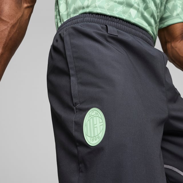 PRODUCT STORY: Inspired by football, designed for life, these track pants move with you. The AC Milan badge on the leg lets you show off your passion for the team, while ripstop material, smooth flatlock stitching and an elasticated waistband provide long-lasting comfort. DETAILS: Slim fit; 239 gsm, Ripstop with flatlock stitching; Medium rise; Elasticated waistband; Official team branding; Official team branding.  Our model is 186 cm tall and is wearing size M UK.