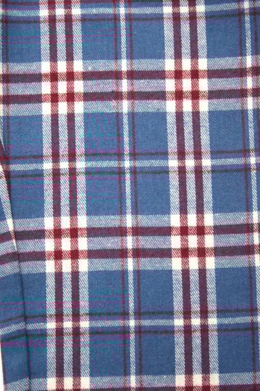 Unisex Lounge pant Pyjama Trouser in Mid blue, Red and White woven check design. 100% Cotton soft brushed woven check fabric. Elastic waist and side pockets. Jersey inner waistband for comfort and an extra drawcord. machine washable. wear them with your favourite T-shirt for that perfect lounge wear outfit.