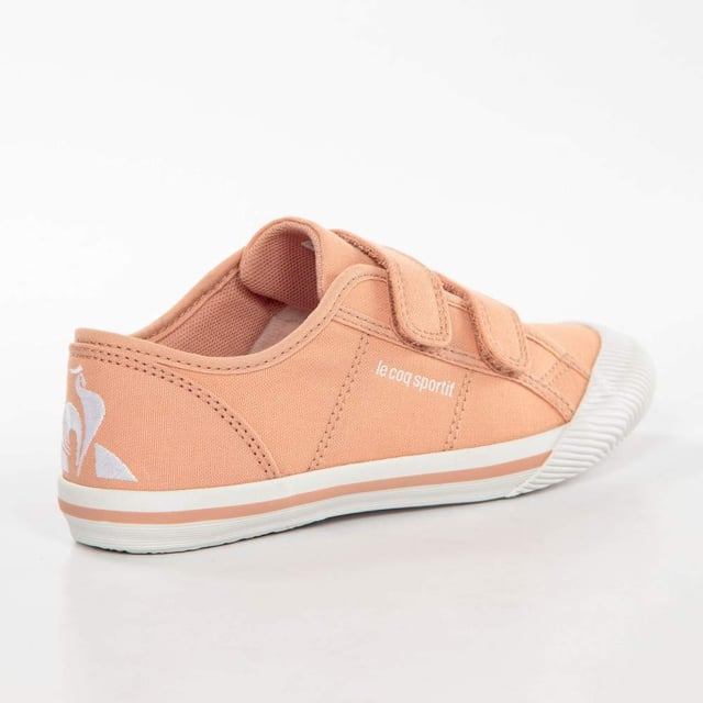 Basket Le Coq Sportif Deauville PS Sport Mädchen Rosa Textil. Authentischer Freizeitschuh der Marke Le Coq Sportif - Straßenmode/Sportswear-Design von Le Coq Sportif - Le Coq Sportif für modebewusste Mädchen, perfekt für den Alltag - Der rosa Le Coq Sportif Basket lässt sich ideal mit dem Rest Ihrer Garderobe kombinieren - Bequemes Textilmaterial - Klassischer Klettverschluss - Deauville PS Sport - Textil.