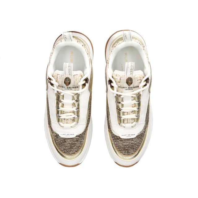 The Kurt Geiger London Kensington Sneaker features a multi-texture upper including crystal embellished houndstooth and suede eyestay. The tongue features a transparent branded monocle with antiqued brass Eagle head.