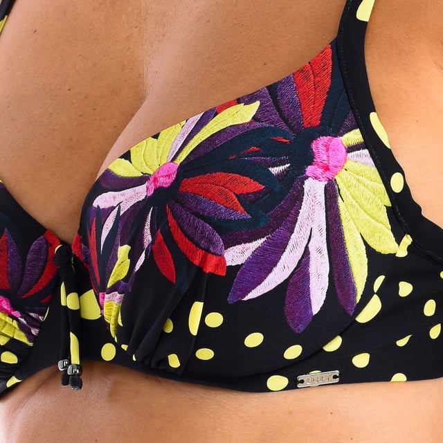 Women's bikini top.
 Super flattering bra cut, with underwire and adjustable straps, on a lively floral print and yellow dots.
 Color Black-patterned
 Avant-garde fabric with high molding power, high resistance to chlorine, tanning creams and oils, and excellent moisture absorption properties.

 Composition: Exterior: 80% Polyamide, 20% Lycra; Interior: 53% Elastane, 38% Lycra, 9% Polyamide.

 Handwash.
 Do not iron or use bleach.
 Do not tumble dry.
 Do not twist to drain.
 Composition: Outer: 80% Polyamide, 20% Lycra; Interior: 53% Elastane, 38% Lycra, 9% Polyamide.
 Care:
Handwash.
 Do not iron or use bleach.
 Do not tumble dry.
 Do not twist to drain.